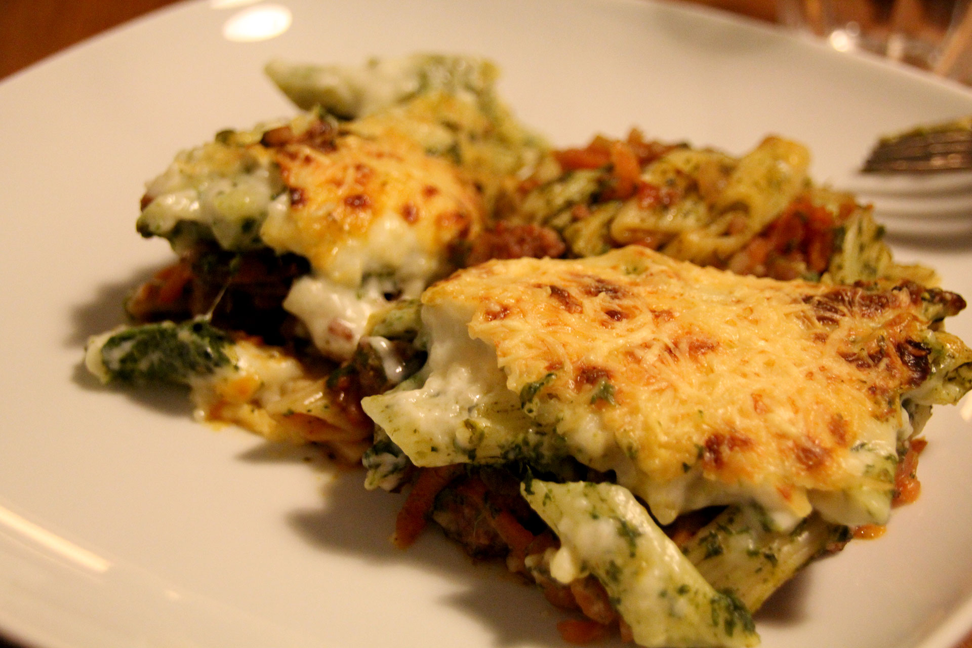 Served sausage, spinach and pasta bake