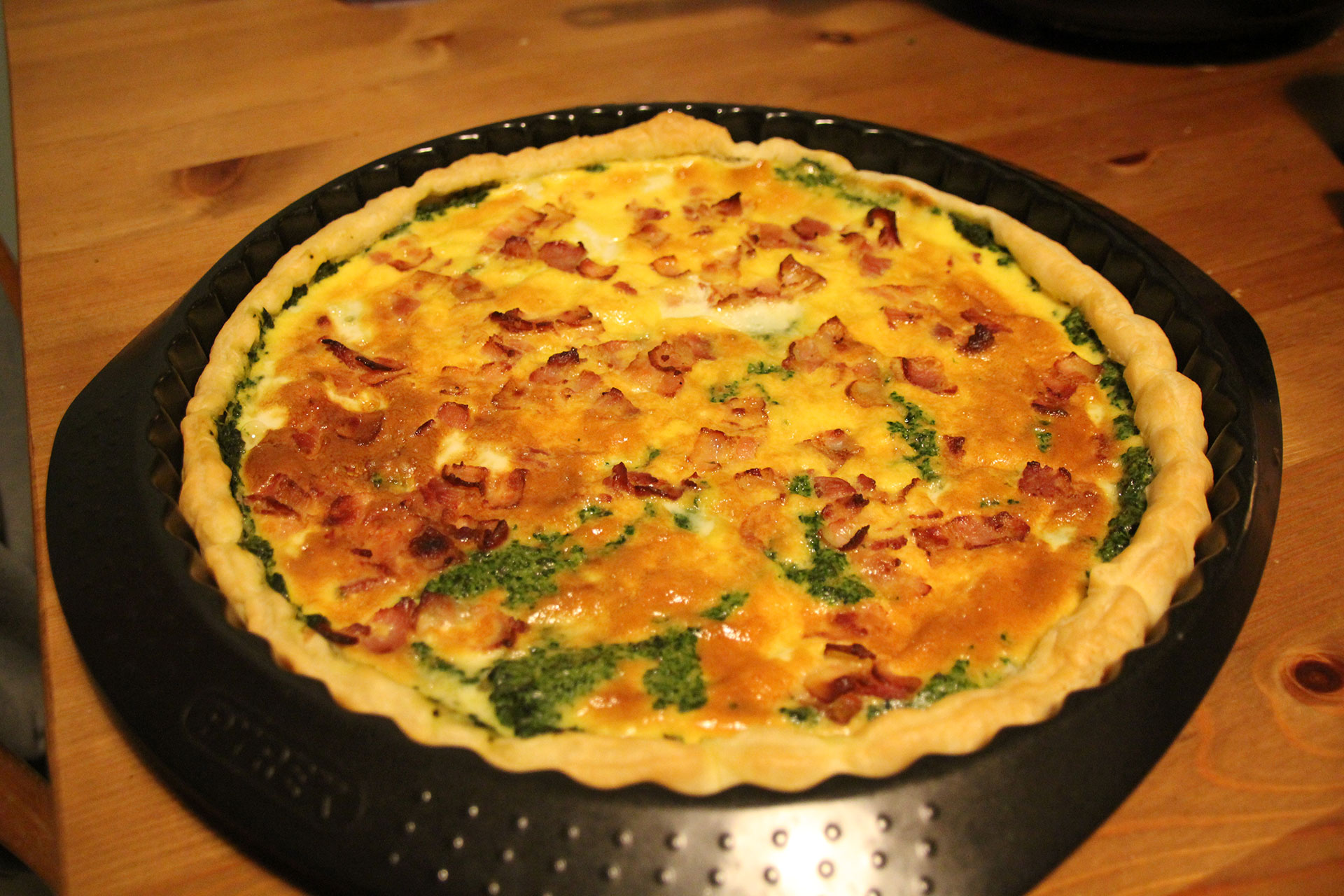 Cooked spinach and bacon quiche